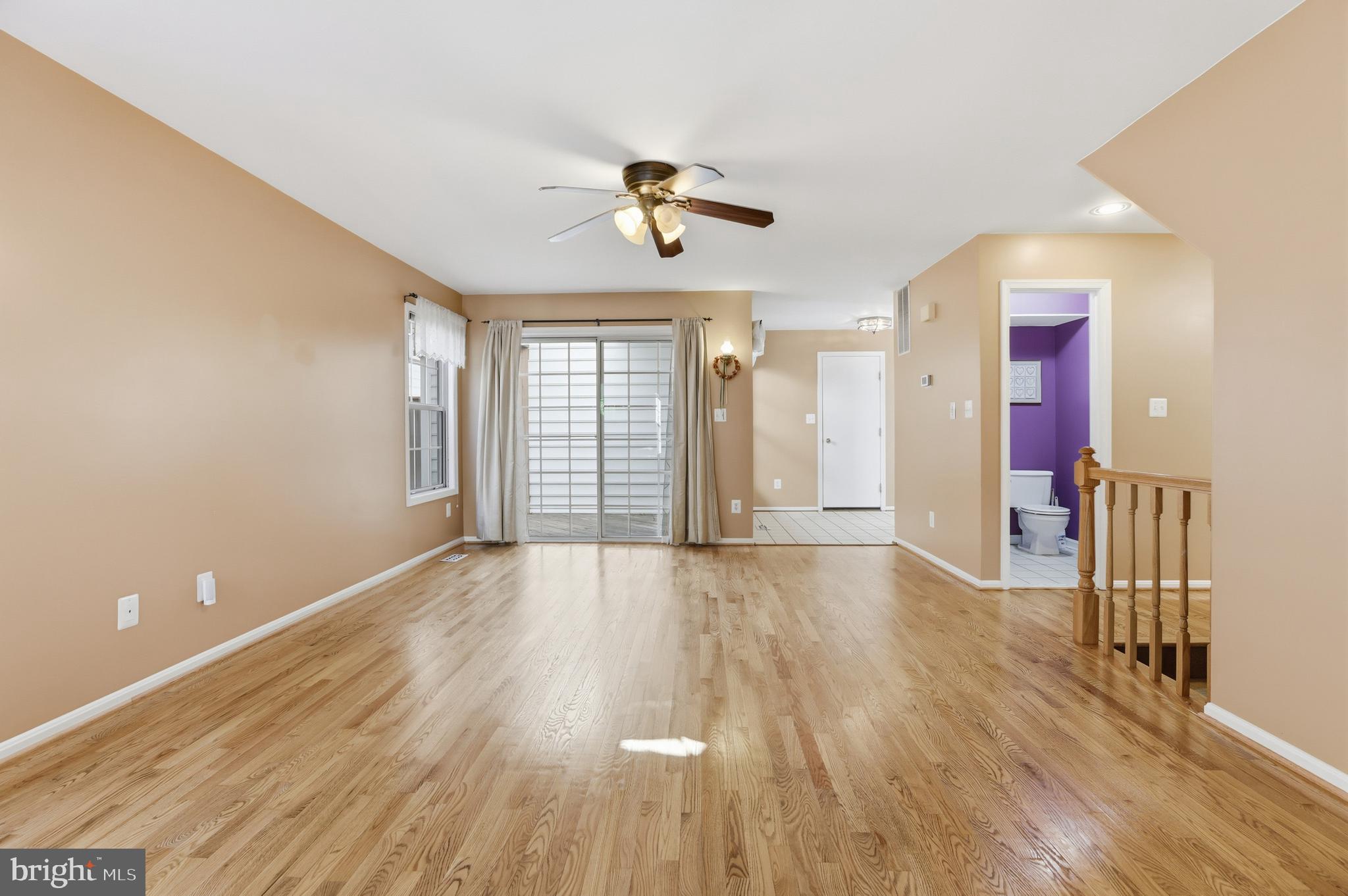 8341 Marketree Circle Montgomery Village, MD 20886 - Photo 8 of 43 wooden floor in an empty room with a window