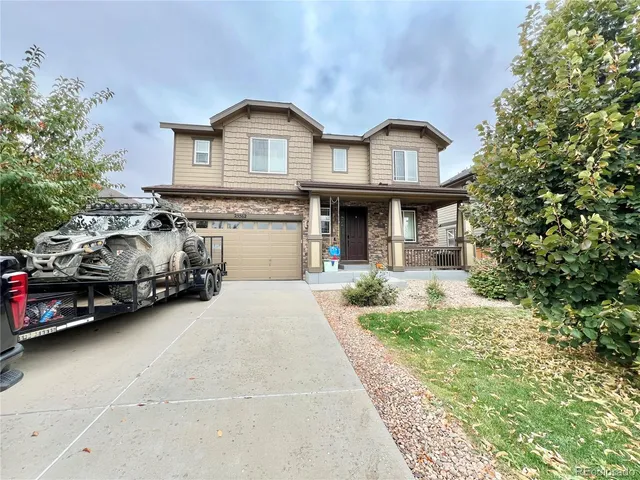 a car parked in front of white house