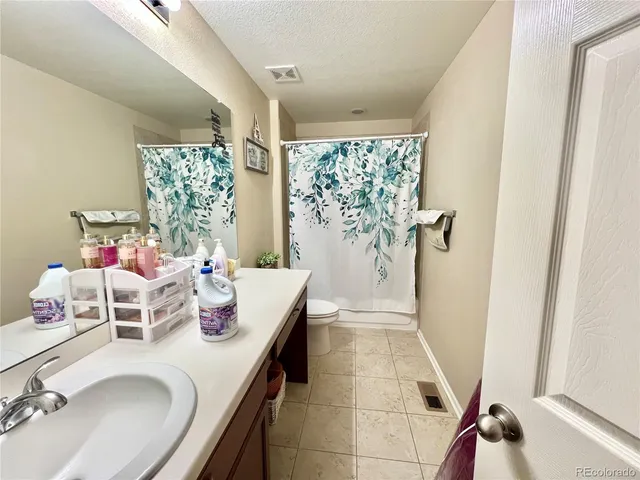 a dining room with furniture and a window