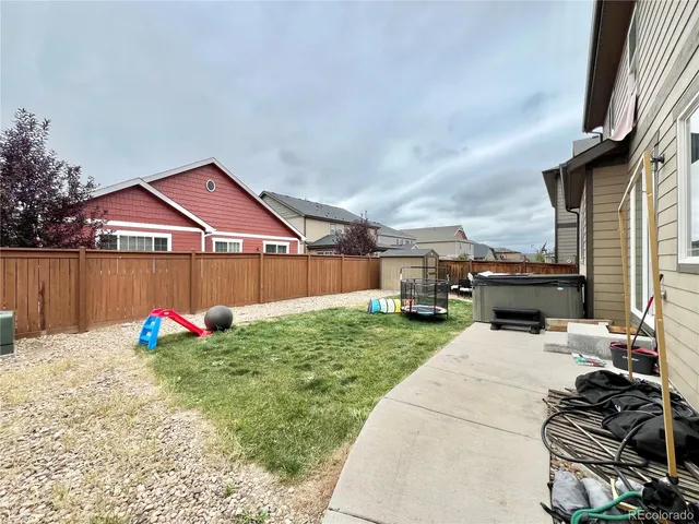 a view of a house with backyard couches and swimming pool