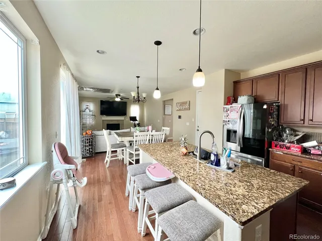a living room with furniture and a table