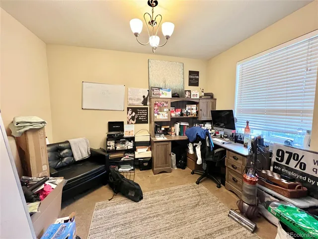 a view of a workspace with furniture