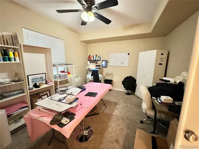 a workspace with furniture and a flat screen tv
