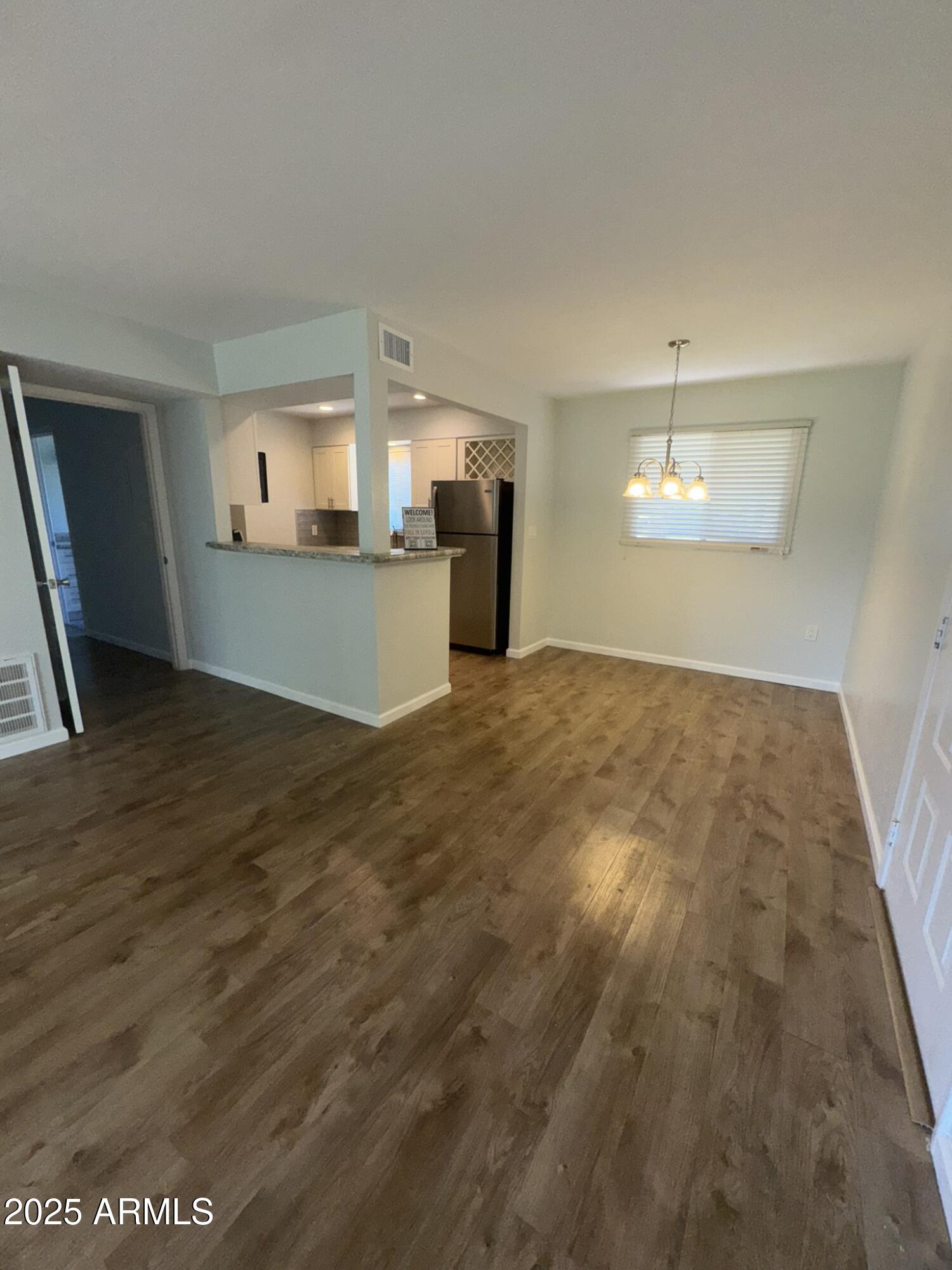 131 North Higley Road, Unit 71 Mesa, AZ 85205 - Photo 6 of 15 a view of a kitchen with wooden cabinet and a sink