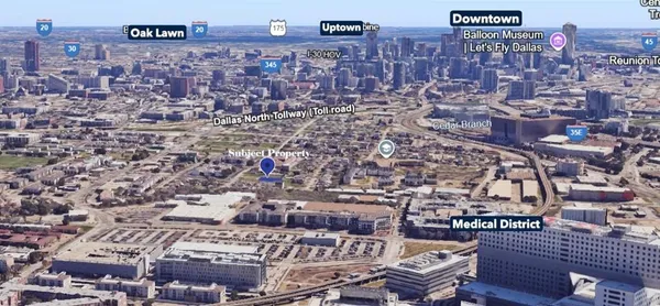 a view of a brick building next to a yard