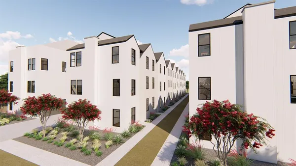 a front view of a large white house