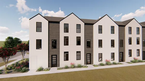 a view of a large building with a big yard and more windows