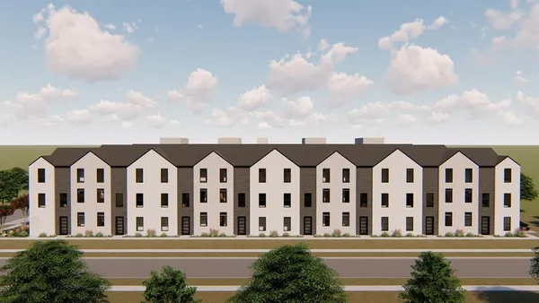 a view of a white house with a lot of windows