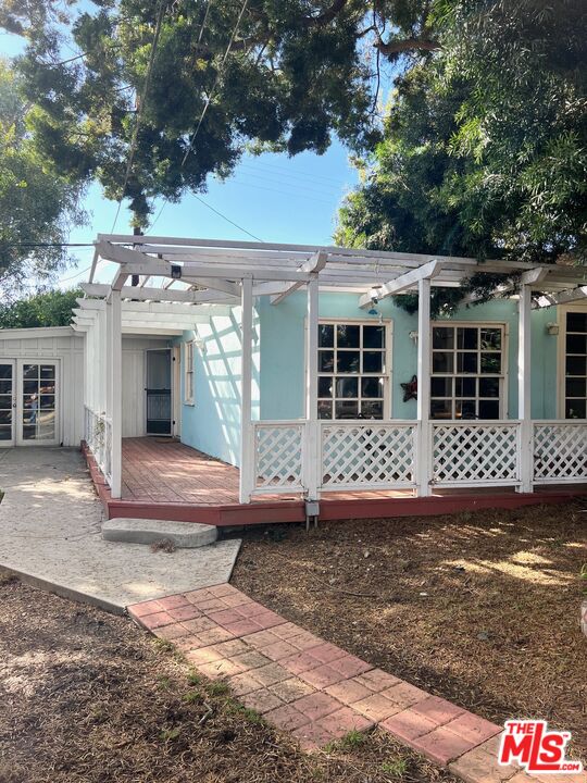 Carmelita Avenue Beverly Hills, CA 90210 - Photo 14 of 14 front view of a house with a yard