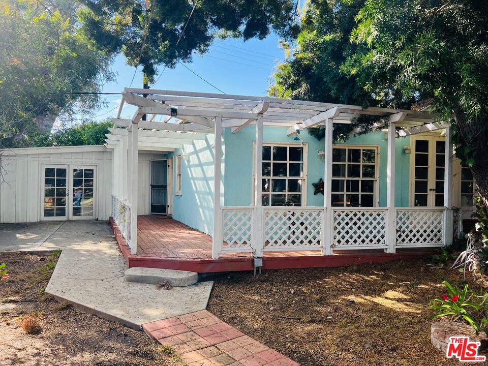 Carmelita Avenue Beverly Hills, CA 90210 - Photo 4 of 14 a front view of a house with a large window