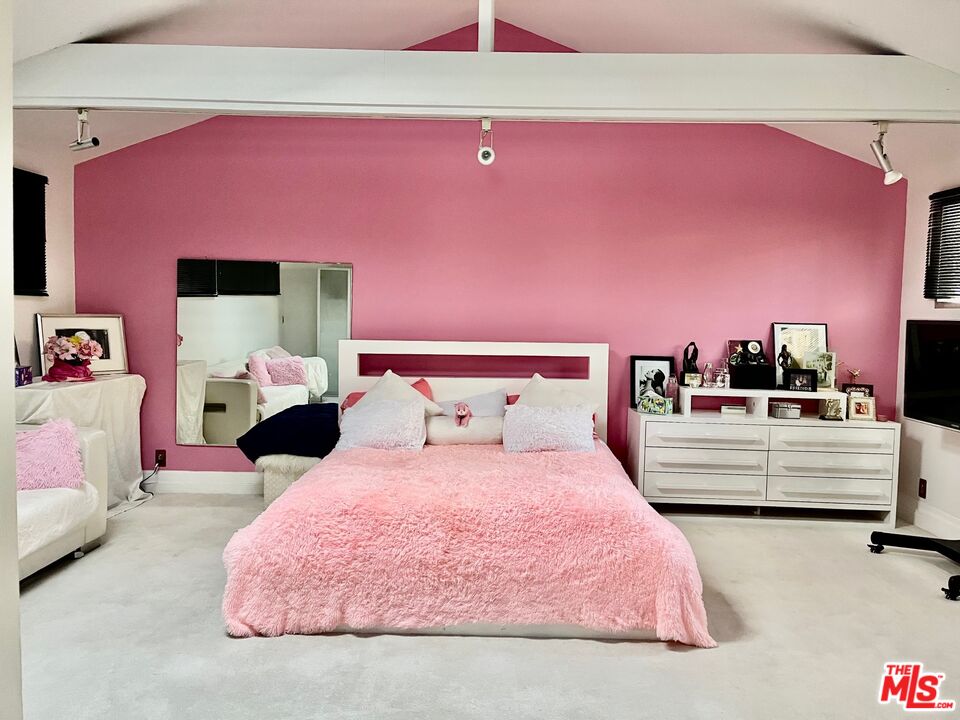 Carmelita Avenue Beverly Hills, CA 90210 - Photo 5 of 14 a bed room with a bed and a couch