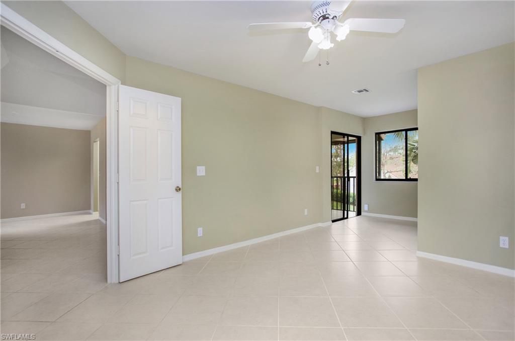 191 Bennington Drive, Unit 124 Naples, FL 34104 - Photo 22 of 26 an empty room with fan and windows