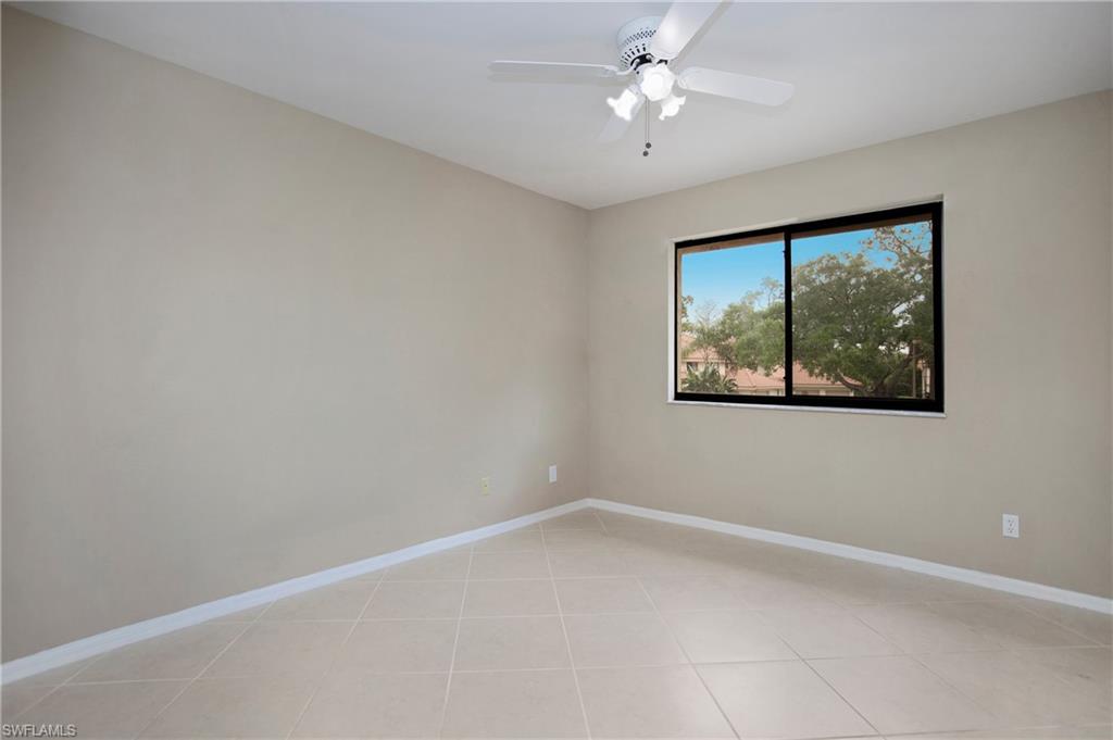191 Bennington Drive, Unit 124 Naples, FL 34104 - Photo 24 of 26 an empty room with a window