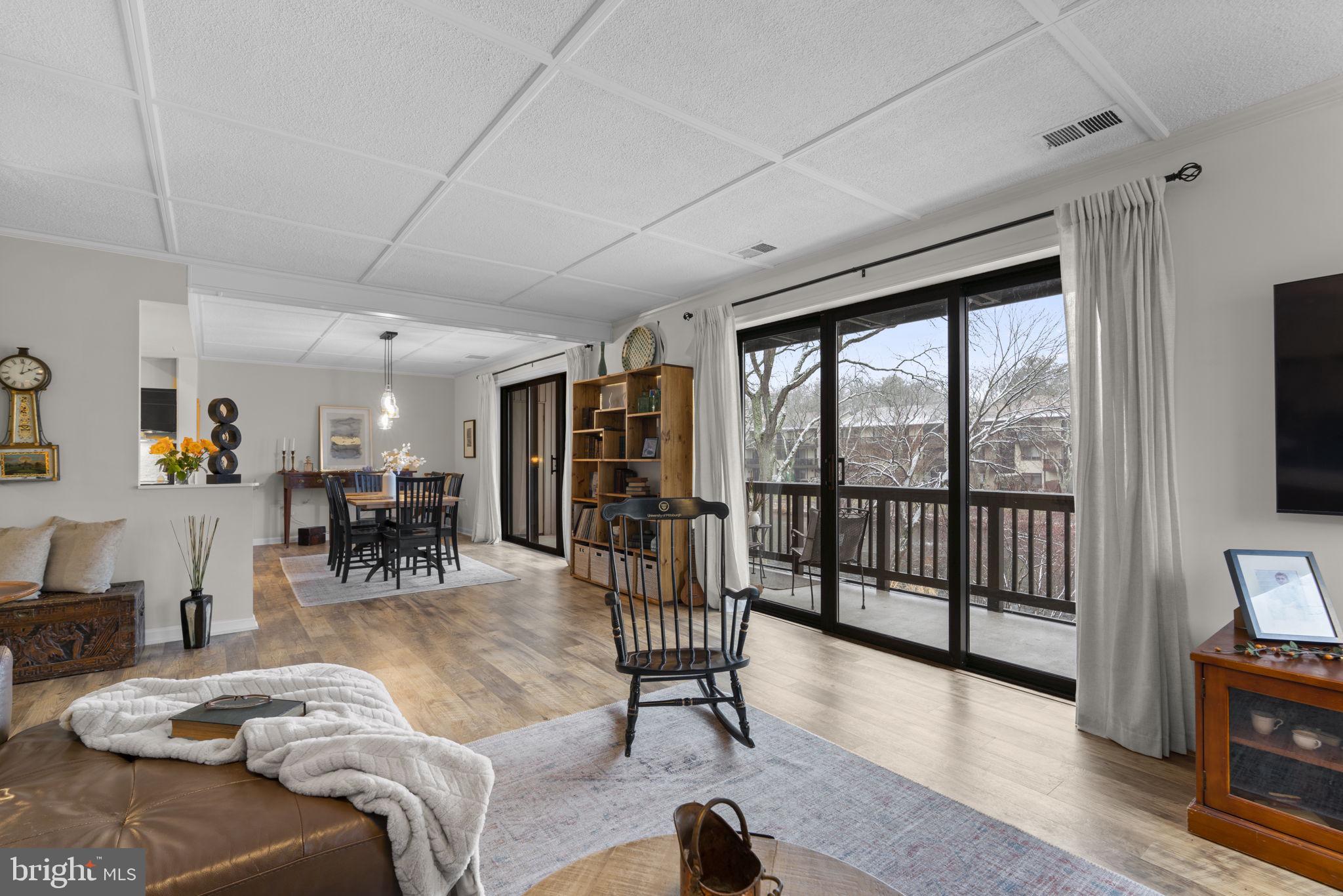 10077 Windstream Drive, Unit 4 Columbia, MD 21044 - Photo 15 of 59 DR and LR with sliders to the oversized balcony