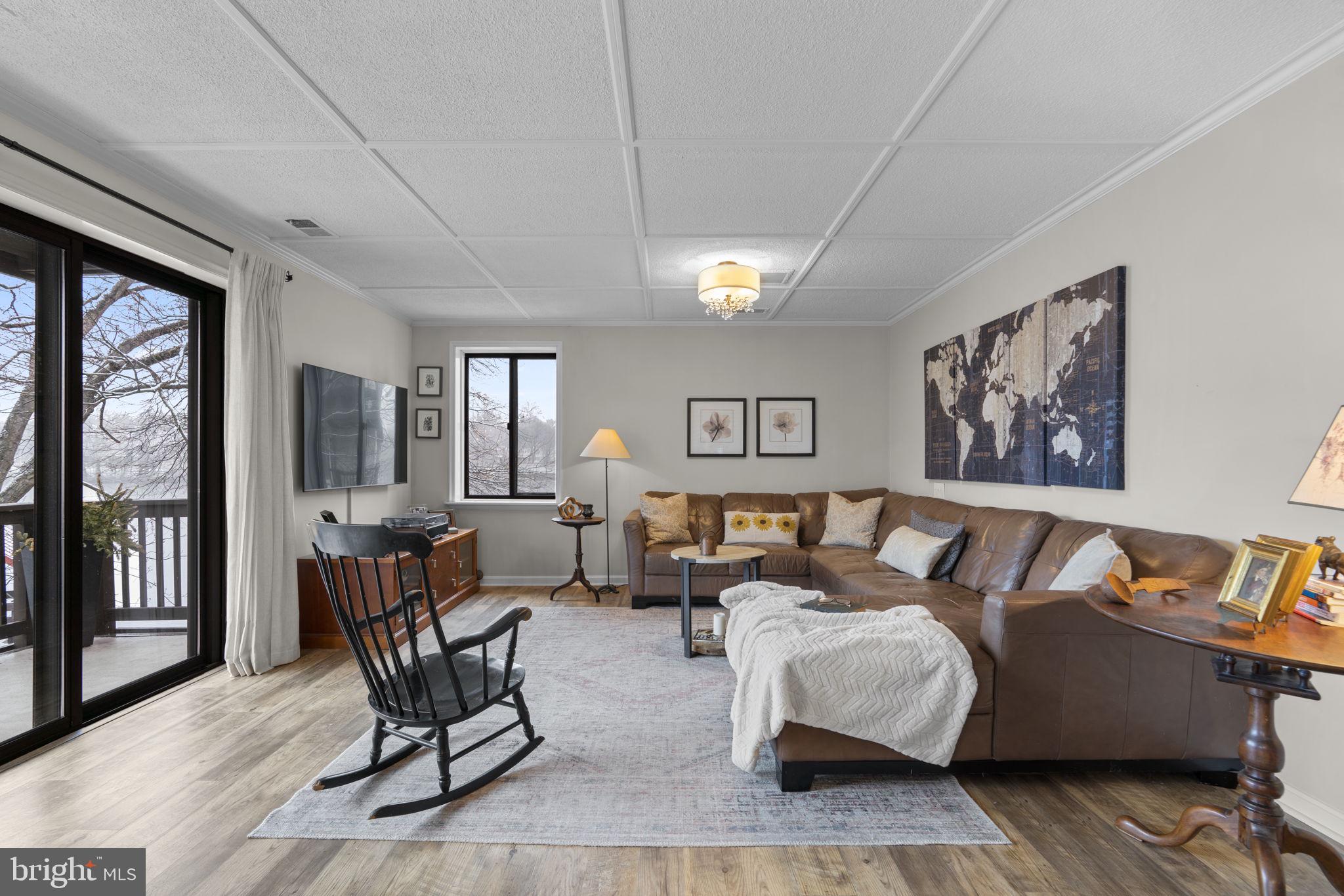 10077 Windstream Drive, Unit 4 Columbia, MD 21044 - Photo 16 of 59 Relax in the LR with updated laminate floors