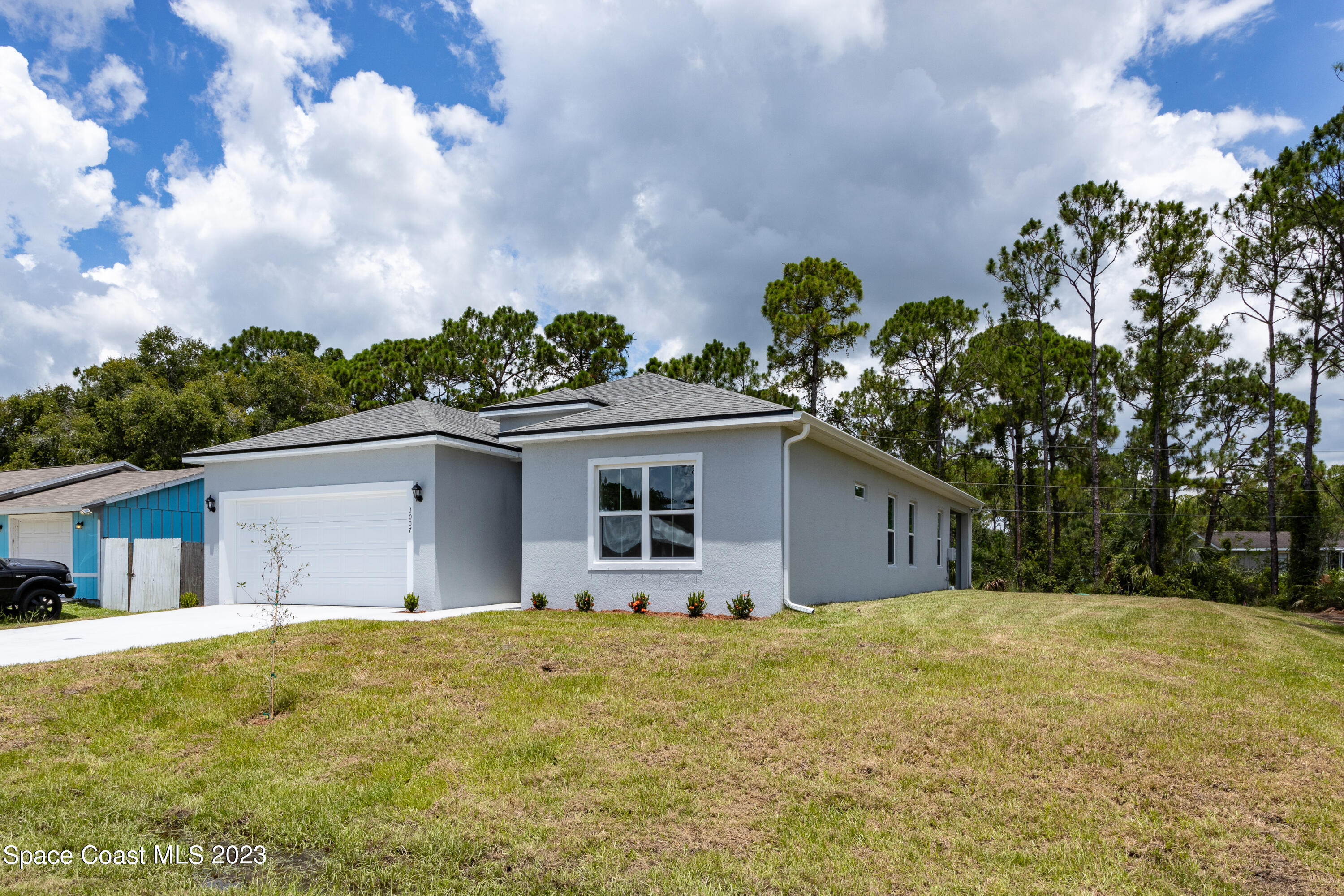 1007 San Rafael Road Southwest Palm Bay, FL 32908 - Photo 3 of 23 a view of a house with a backyard