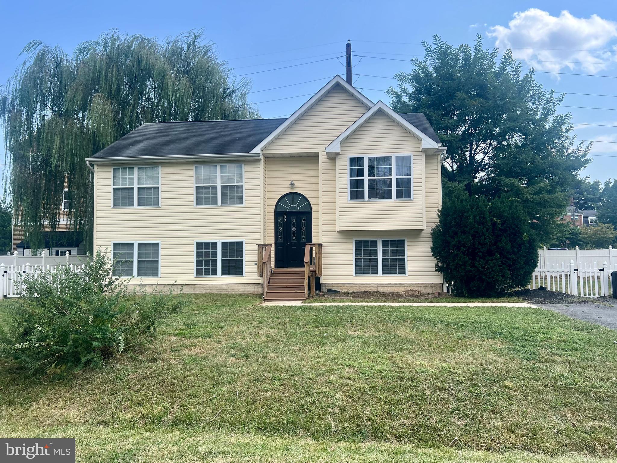 103 Henson Road Glen Burnie, MD 21060 - Photo 1 of 29 a front view of a house with a yard