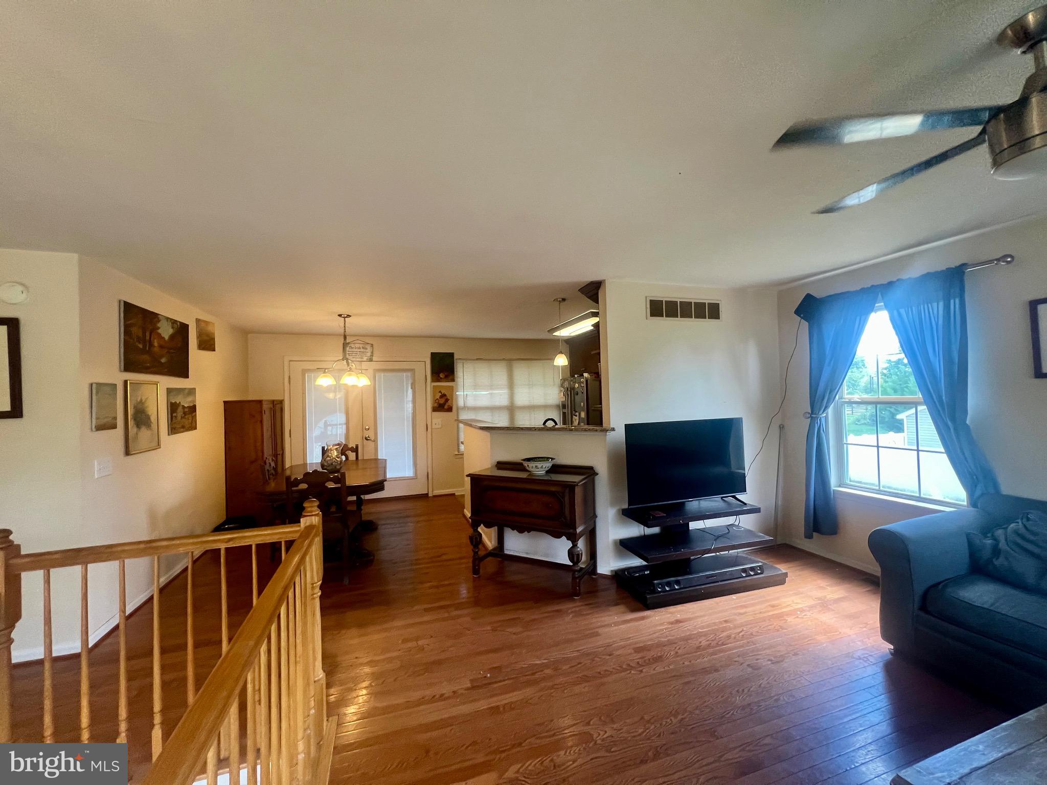103 Henson Road Glen Burnie, MD 21060 - Photo 11 of 29 a living room with furniture and a flat screen tv
