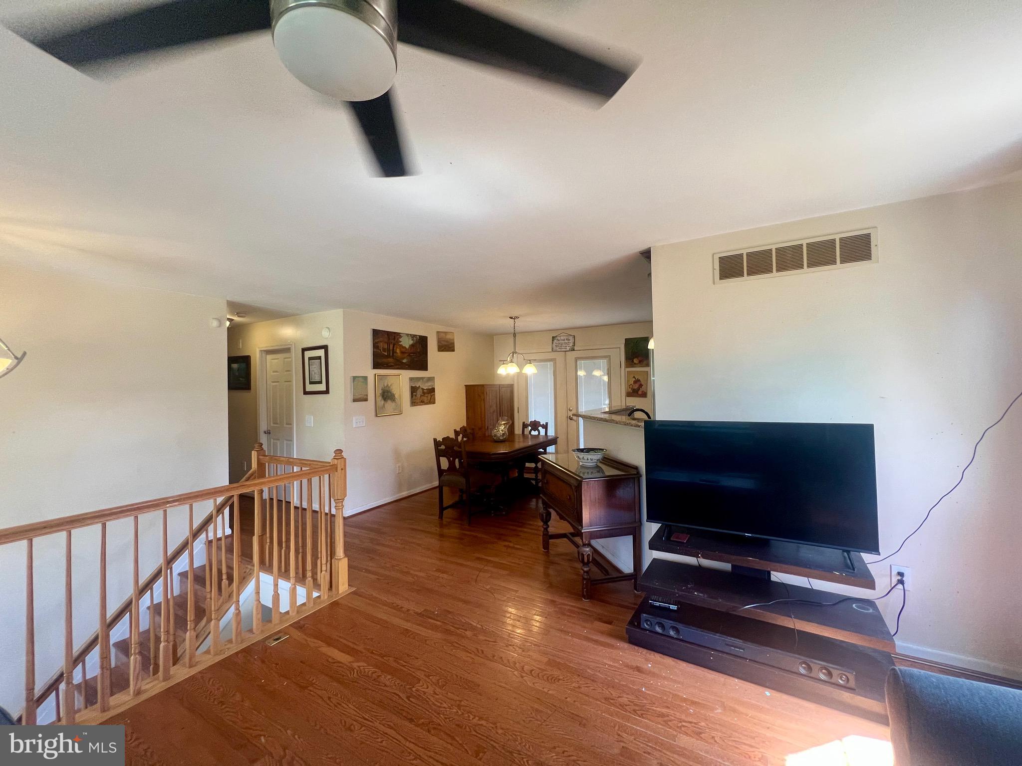 103 Henson Road Glen Burnie, MD 21060 - Photo 12 of 29 a living room with furniture and a flat screen tv