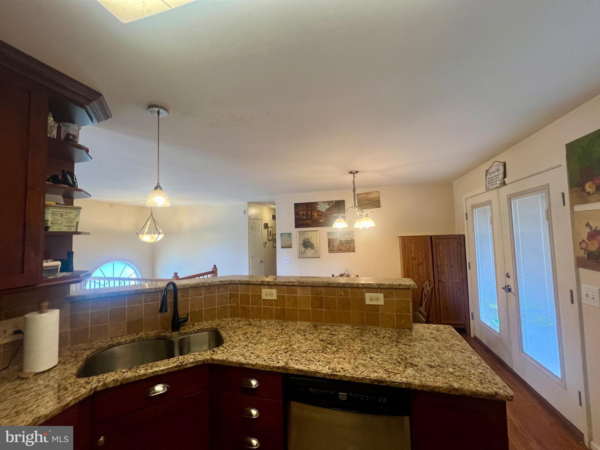 103 Henson Road Glen Burnie, MD 21060 - Photo 17 of 29 a kitchen with stainless steel appliances granite countertop a sink stove and refrigerator