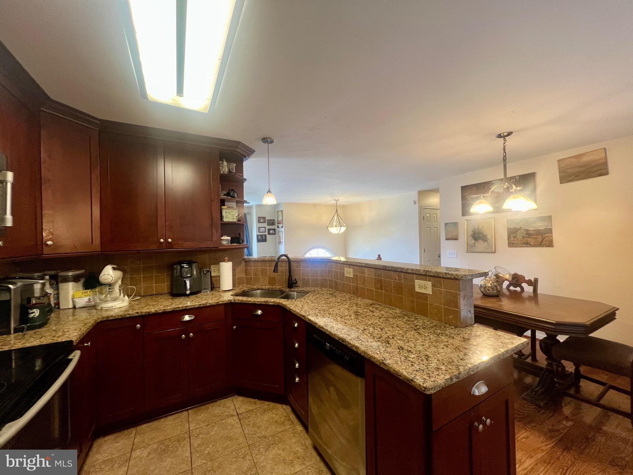 103 Henson Road Glen Burnie, MD 21060 - Photo 18 of 29 a kitchen with a sink and stove