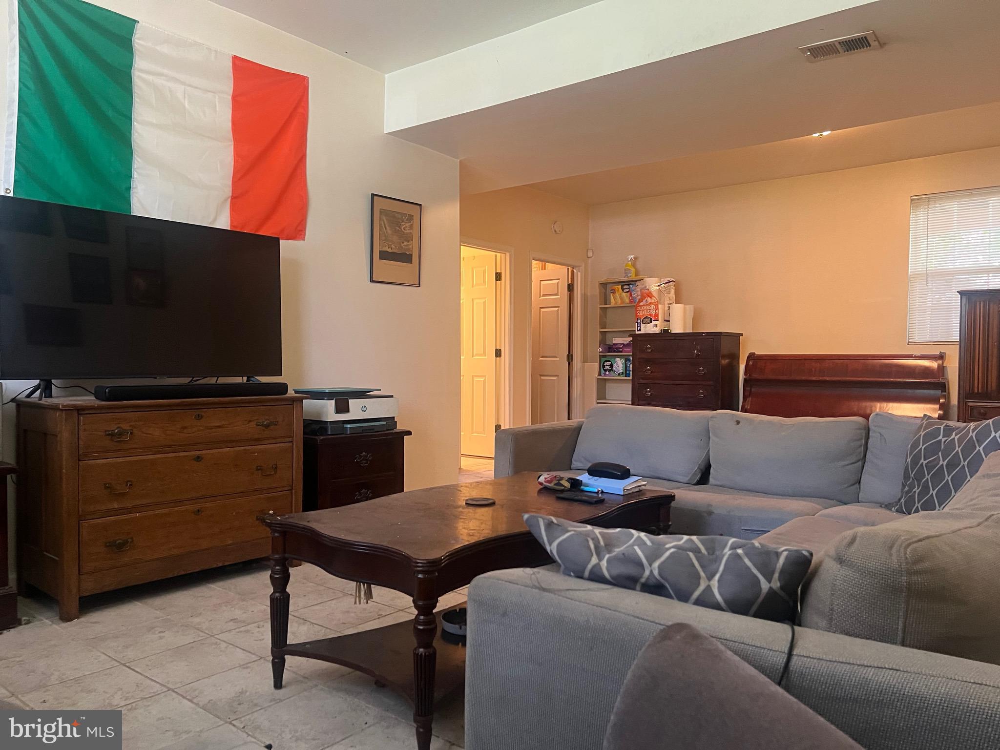 103 Henson Road Glen Burnie, MD 21060 - Photo 20 of 29 a living room with furniture and a flat screen tv
