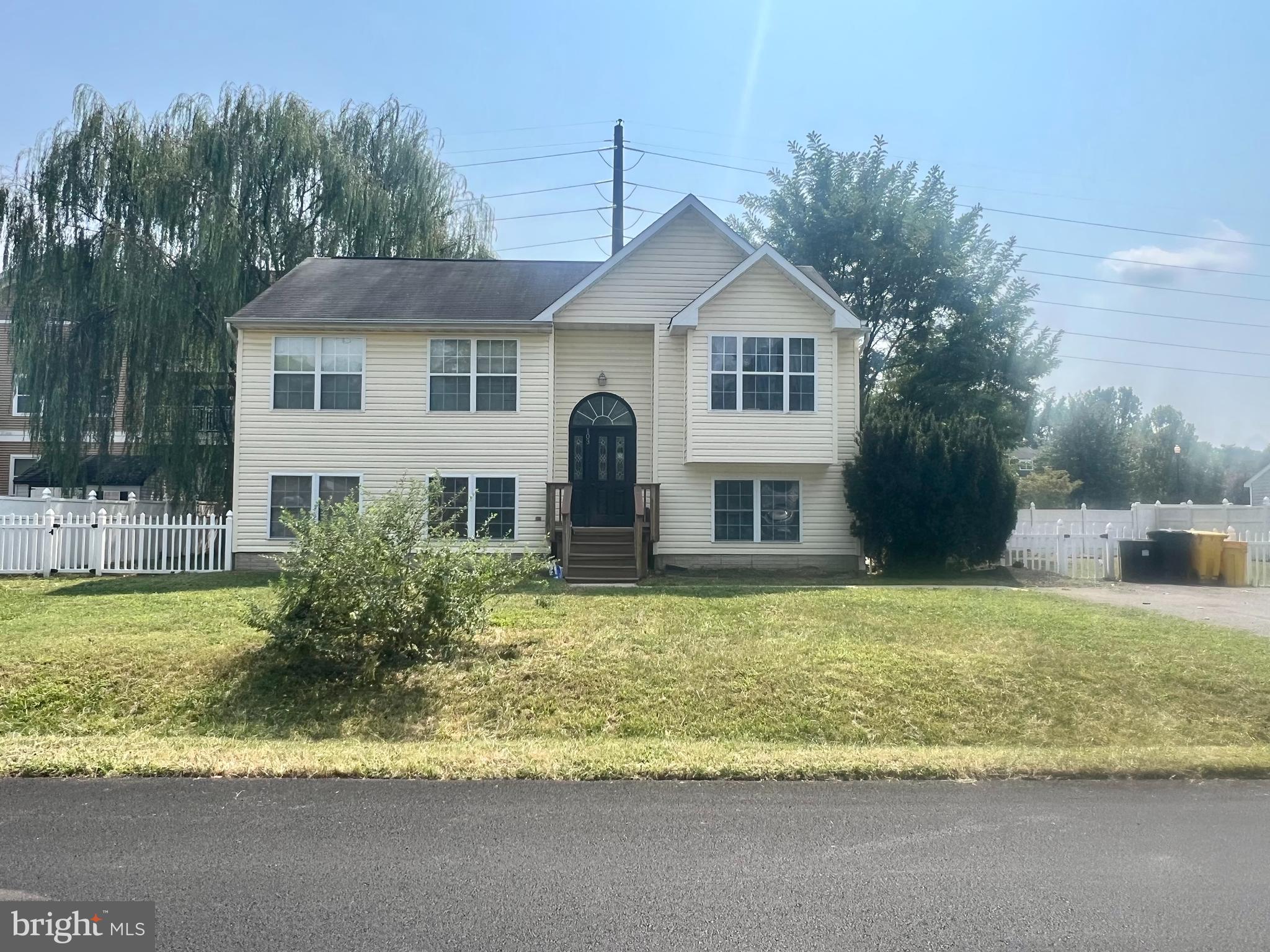 103 Henson Road Glen Burnie, MD 21060 - Photo 2 of 29 a front view of a house with a yard outdoor seating and lake view
