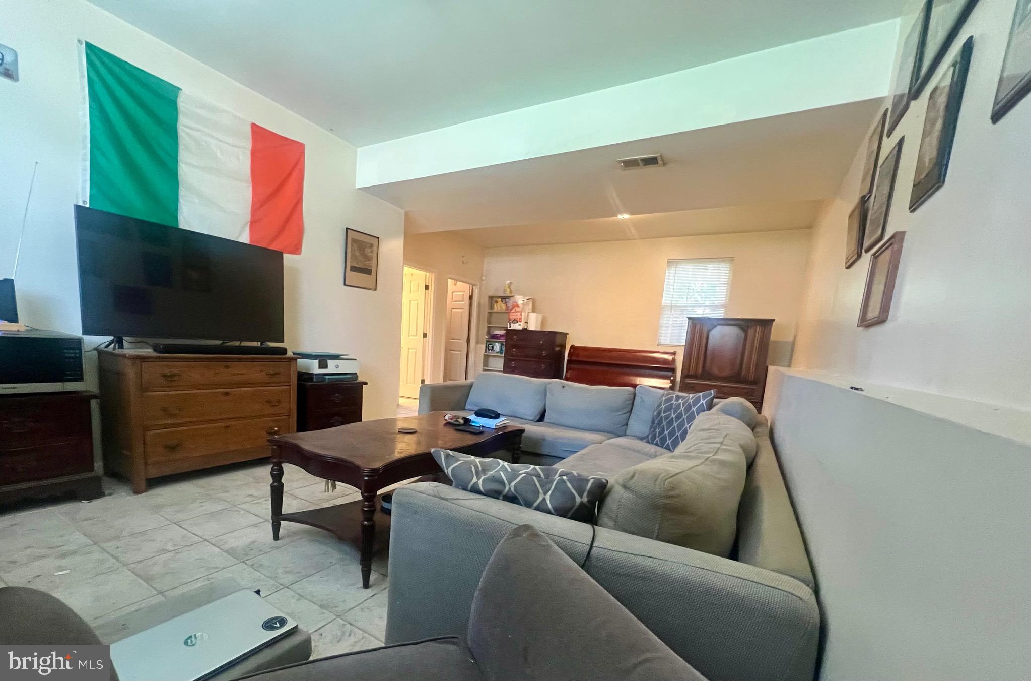 103 Henson Road Glen Burnie, MD 21060 - Photo 21 of 29 a living room with furniture and a flat screen tv