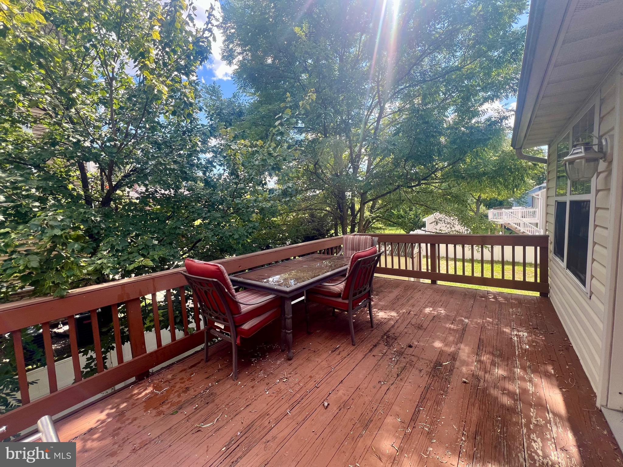 103 Henson Road Glen Burnie, MD 21060 - Photo 23 of 29 a view of a wooden bench on the roof deck