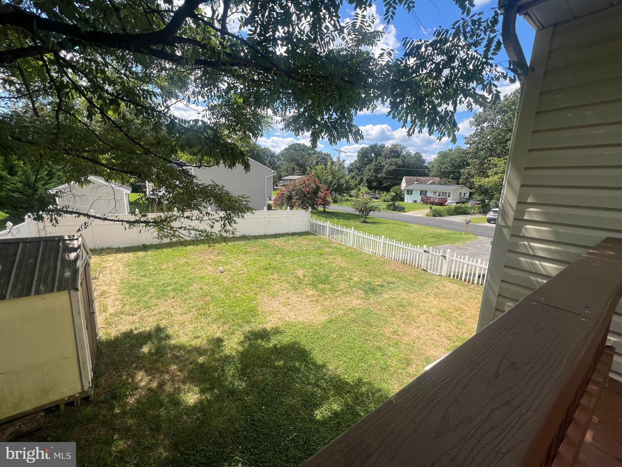 103 Henson Road Glen Burnie, MD 21060 - Photo 28 of 29 a view of a swimming pool with an outdoor seating and a yard