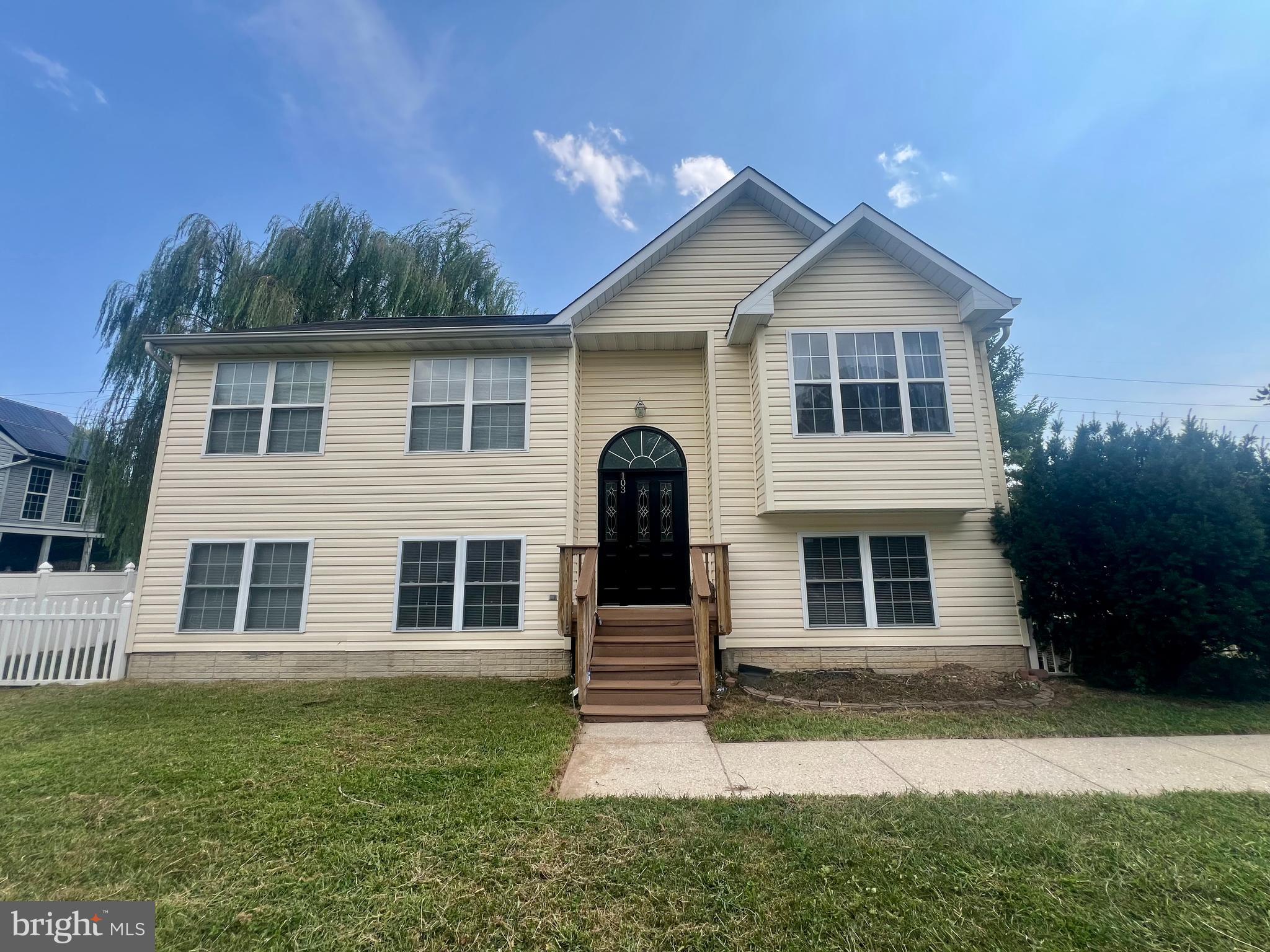 103 Henson Road Glen Burnie, MD 21060 - Photo 3 of 29 a front view of a house with a yard