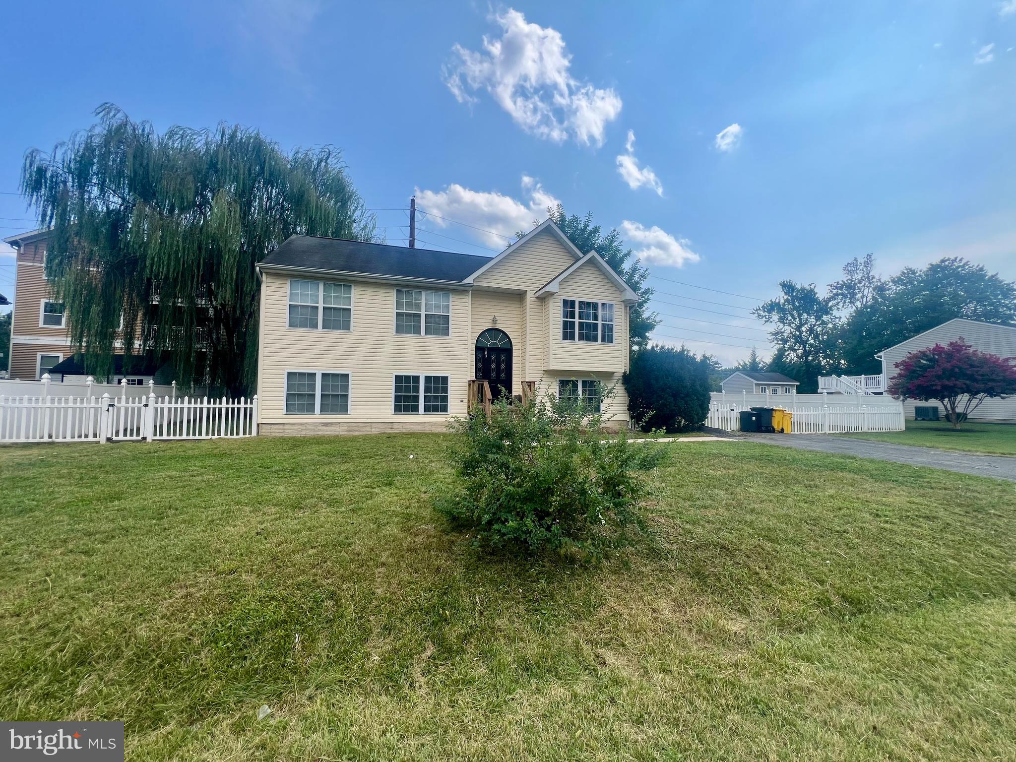 103 Henson Road Glen Burnie, MD 21060 - Photo 6 of 29 a front view of a house with a yard