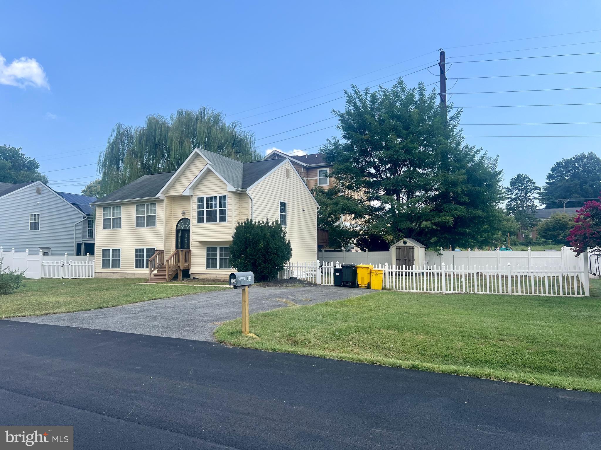 103 Henson Road Glen Burnie, MD 21060 - Photo 7 of 29 a view of a house with a yard and tree s