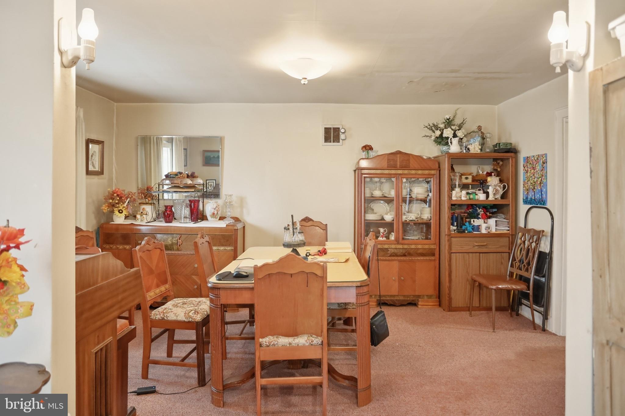 378 Spruce Street Thomas, WV 26292 - Photo 15 of 30 a view of a dining room with furniture and chandelier