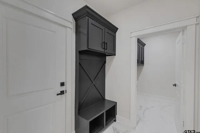 a bathroom with a sink and mirror