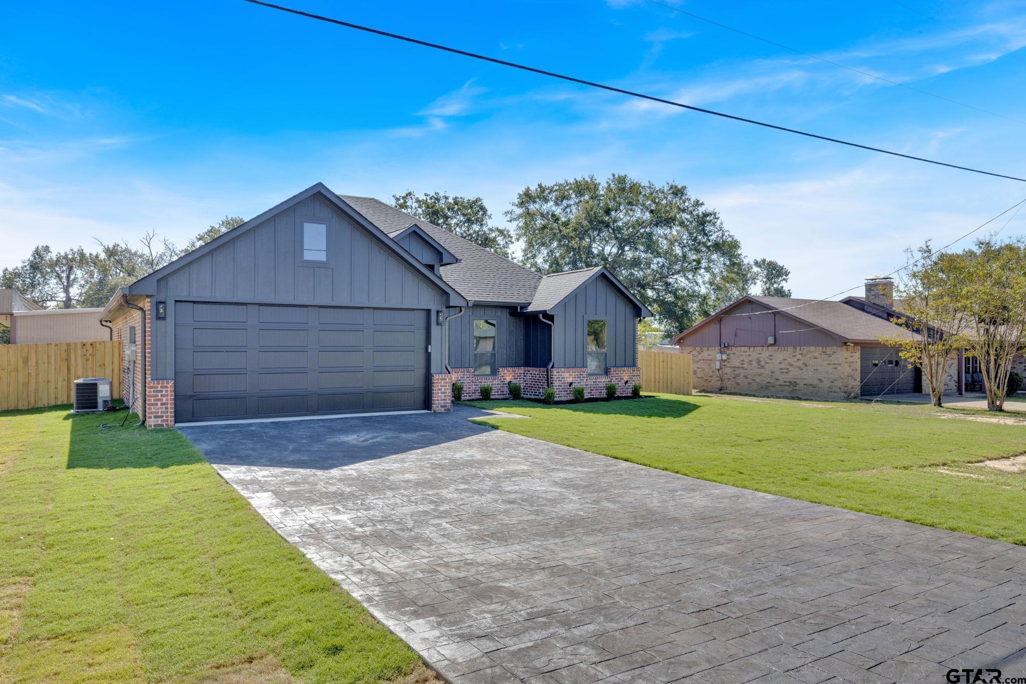 11089 Tammi Trail Tyler, TX 75709 - Photo 2 of 30 a front view of house with yard and outdoor seating
