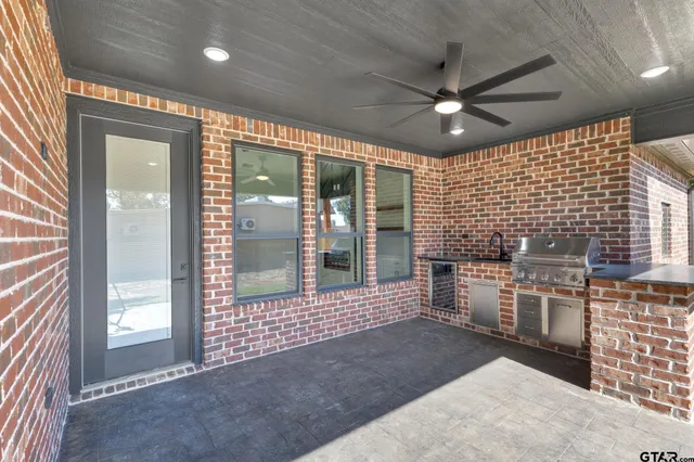 a view of a house with a tree