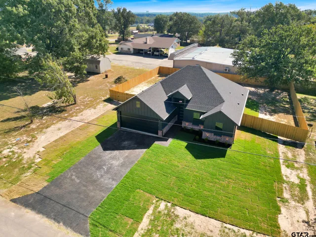 an aerial view of a house with garden
