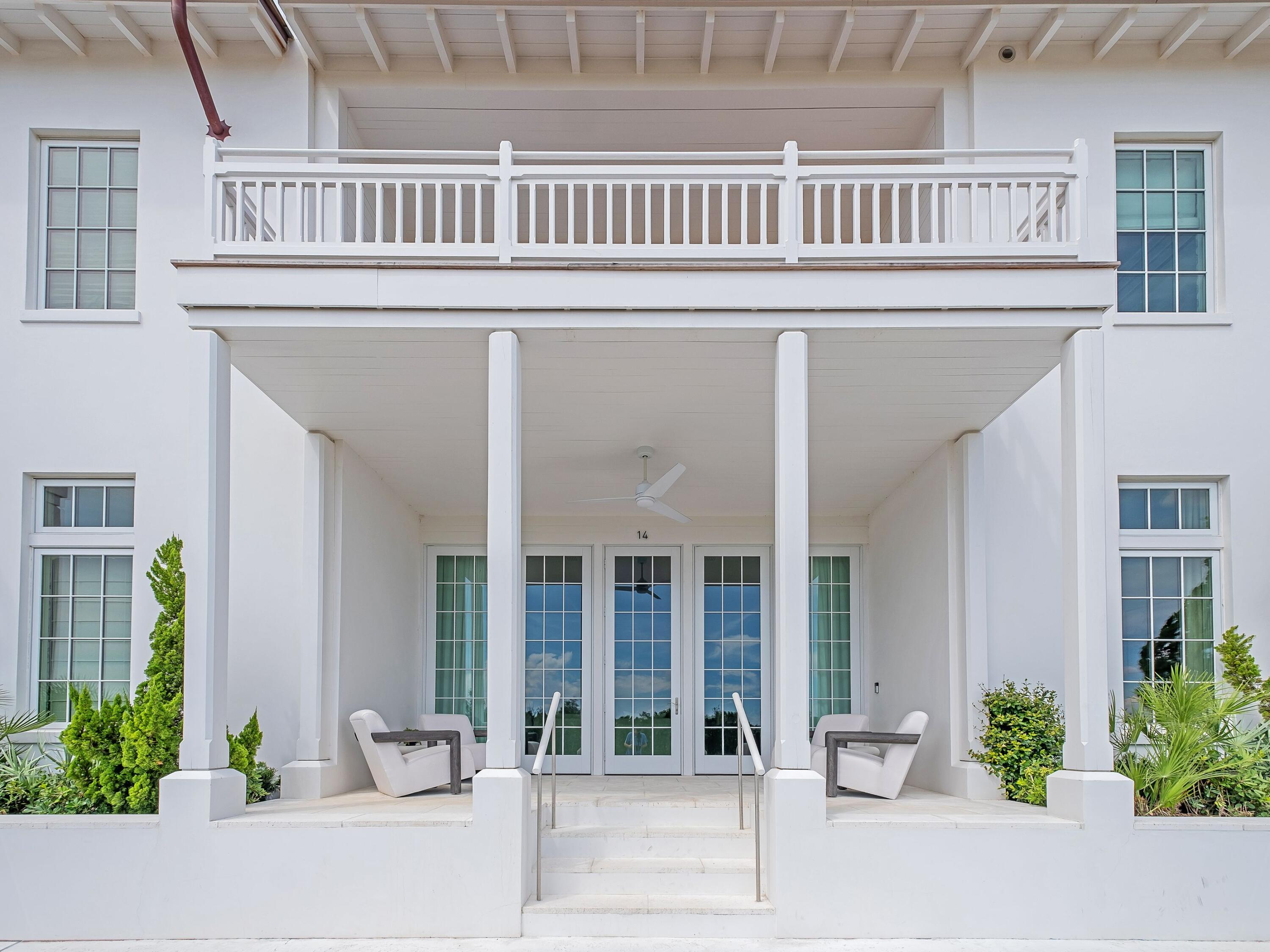 19 Astra Way Inlet Beach, Unit M14 Inlet Beach, FL 32461 - Photo 1 of 30 a balcony view with a potted plant and windows