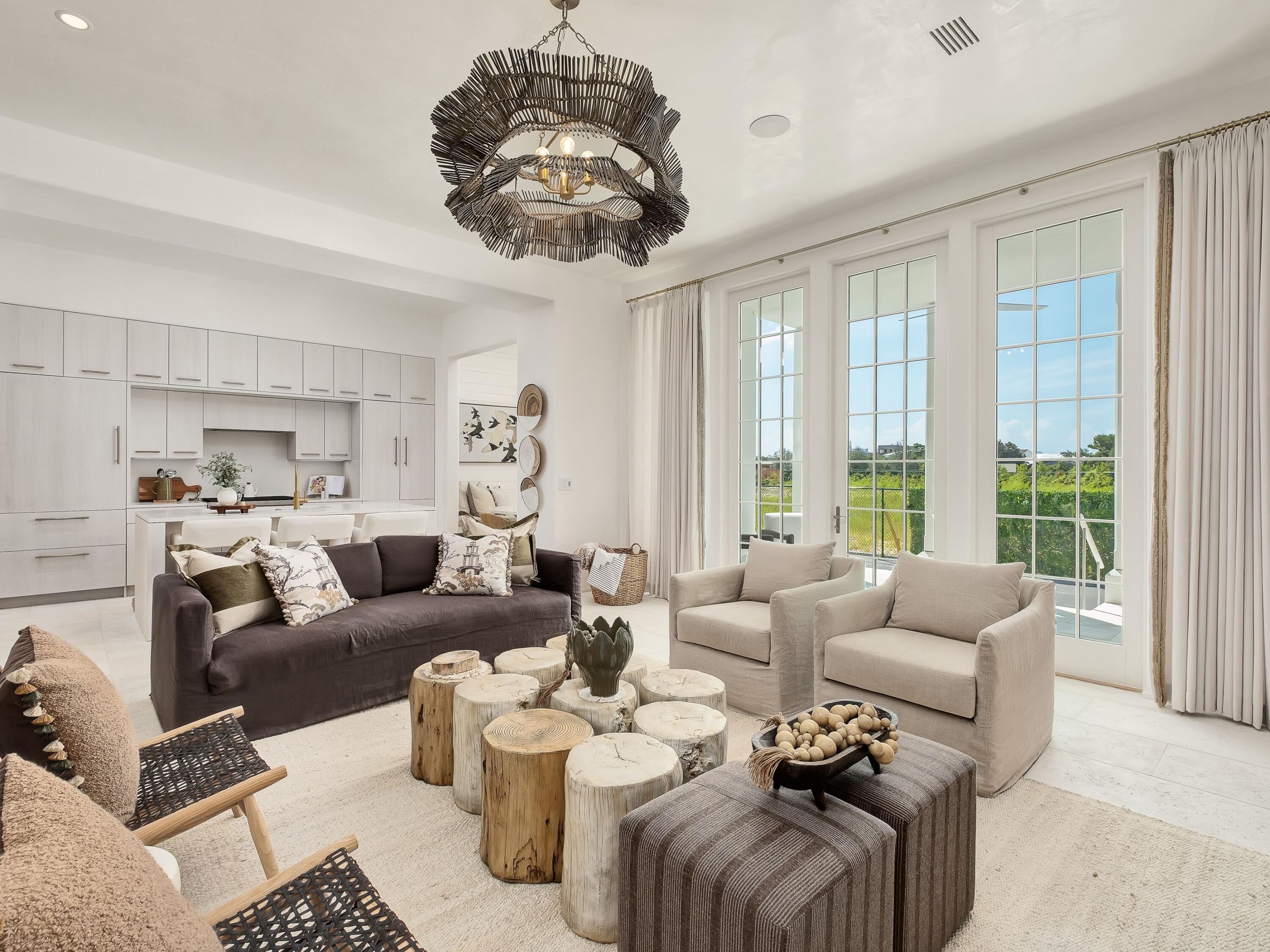 19 Astra Way Inlet Beach, Unit M14 Inlet Beach, FL 32461 - Photo 11 of 30 a living room with furniture a chandelier and a large window