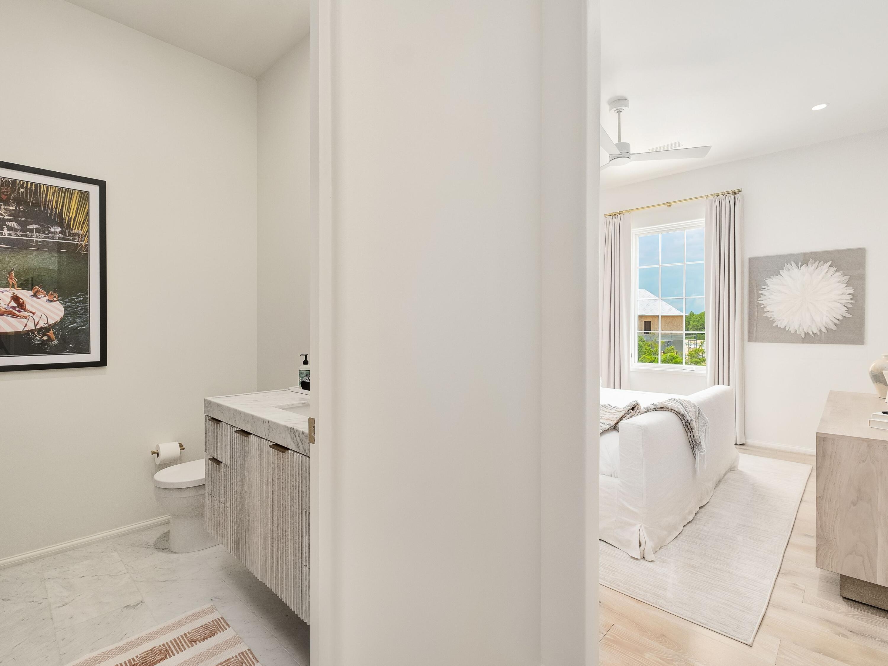 19 Astra Way Inlet Beach, Unit M14 Inlet Beach, FL 32461 - Photo 22 of 30 a bathroom with a toilet and a vanity