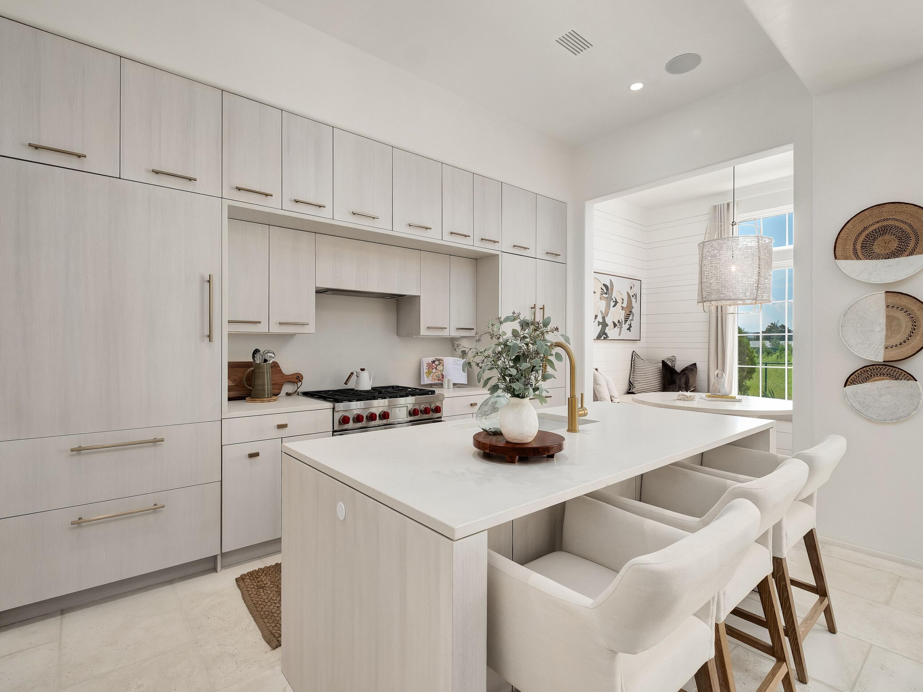 19 Astra Way Inlet Beach, Unit M14 Inlet Beach, FL 32461 - Photo 5 of 30 a kitchen with a white cabinets and appliances