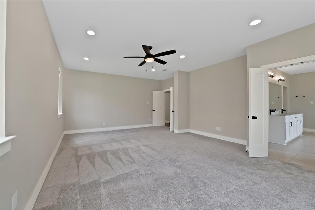 2223 Providence Way Nevada, TX 75173 - Photo 36 of 40 wooden floor in an empty room with a ceiling fan