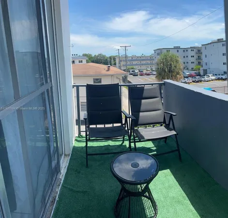 a view of a chairs in backyard of house