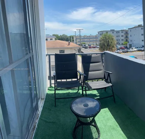 a view of a chairs in backyard of house