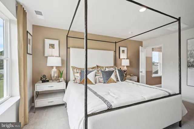a bathroom with a glass shower door and a mirror