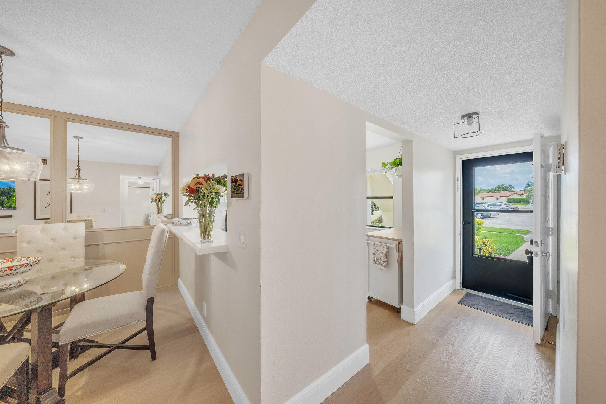 22136 Palms Way, Unit 103 Boca Raton, FL 33433 - Photo 34 of 42 a view of a dining room with furniture and wooden floor