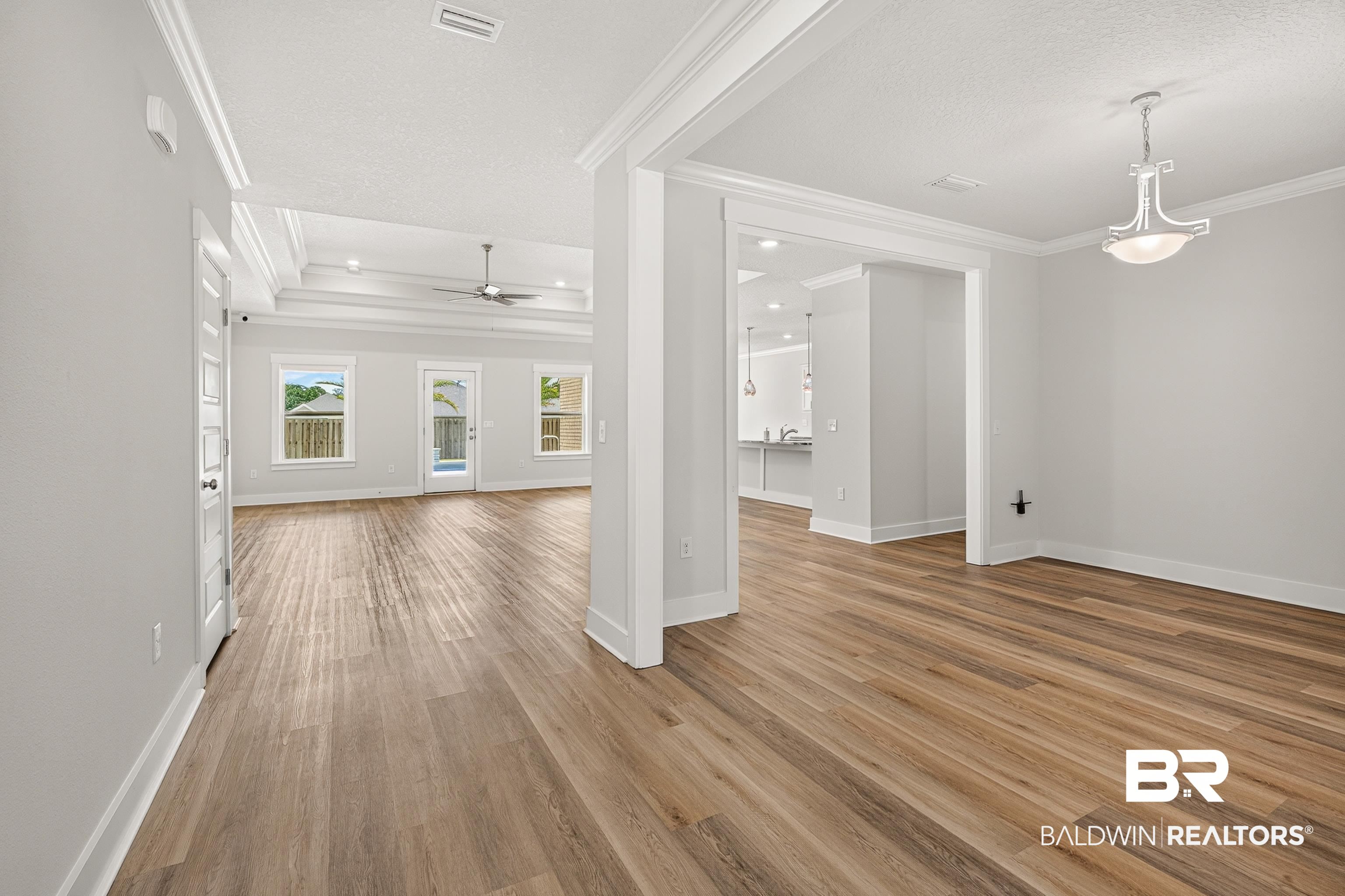 1724 Partridge Street Foley, AL 36535 - Photo 11 of 62 Spacious open-concept interior featuring wood-finish flooring throughout