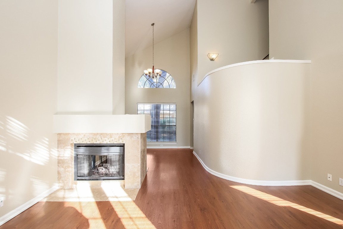 2802 Hummingbird Circle Cedar Park, TX 78613 - Photo 3 of 15 a view of a room with wooden floor and fireplace