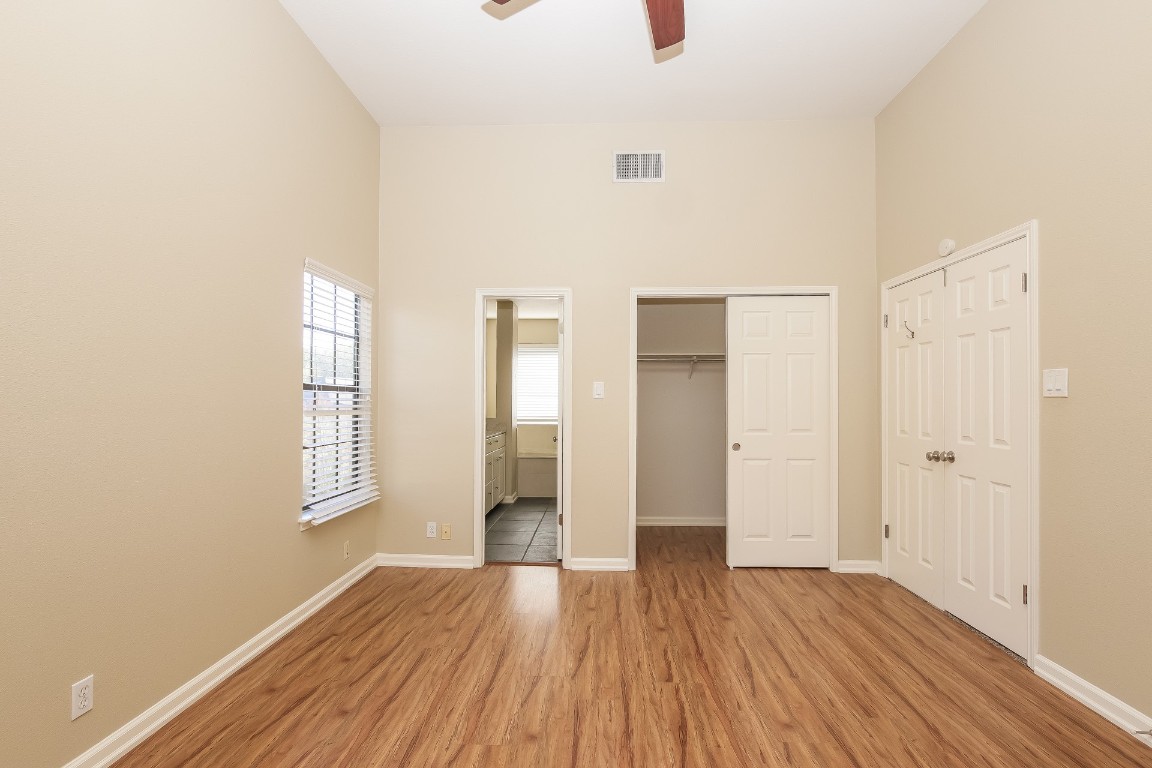 2802 Hummingbird Circle Cedar Park, TX 78613 - Photo 8 of 15 a view of an empty room with wooden floor and window
